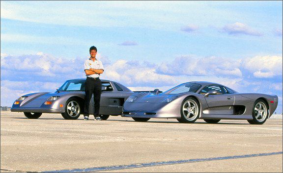 This is a photo of Warren Mosler posing with the Consulier GTP and the MT-900 both cars he created.